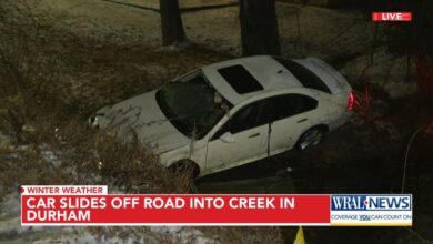 Vehicle pulled from creek after crash on Dearborn Drive, 2 hospitalized with minor injuries